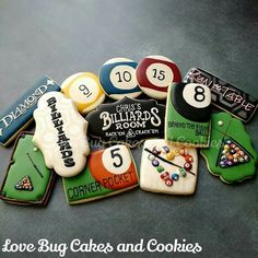 some cookies that have been decorated to look like billiards pool balls and numbers