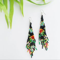 Beautiful Floral Loom Seed Bead Fringe Tassel Duster Tapestry Drop Earrings. Approximately 4.75 Inches Long. Also Available In White (See Other Listing). Adjustable Bohemian Beaded Earrings With Black Beads, Bohemian Adjustable Beaded Earrings, Black Large Beaded Dangle, Black Large Beaded Drop Earrings, Black Bohemian Beaded Earrings As Gift, Black Bohemian Beaded Earrings For Gift, Bohemian Black Beaded Earrings For Gifts, Black Beaded Drop Earrings With Large Beads, Black Earrings With Large Round Beads