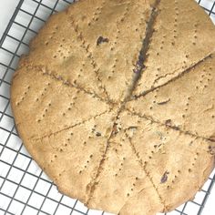 a cookie sitting on top of a cooling rack