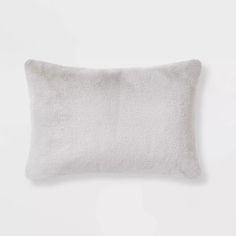 a white pillow on a white wall