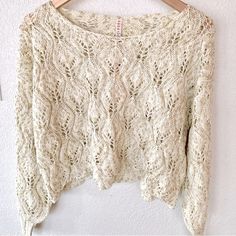 Anthropologie Raga Vintage Appeal Boho Cream & Shimmering Gold Lurex Open Knit Cropped Sweater Knit Top - Cropped Boxy Styling, Length Hits At Waistline. Wear With A Long Camisole, Over A Body Suit For Layered Look Or As Is With A Bralette. The Light Weight Knit Makes This A Perfect Top As Sweater Can Be Worn From Season To Season. Size Small Size 4-6: See Lay Flat Measurements Armpit To Armpit 22” Length 16” Tags: Soft, Casual, Stylish, Weekend, Outdoor, Going Out, Sweaters, Pullover Sweater, K Sweaters Pullover, Knit Cropped Sweater, Haute Hippie, Casual Stylish, Top Cropped, Anthropologie Top, Knit Crop Top, Knit Crop, Open Knit