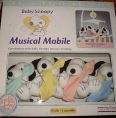 a package of musical mobiles with snoopy nursery animals in the box for sale