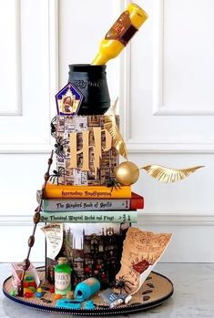 a stack of books sitting on top of a plate covered in magnets and paper