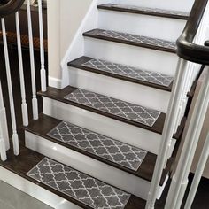 a set of stairs with rugs on them