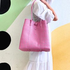 This versatile tote is a must-have accessory for all your warm-weather & cool weather adventures. Whether you're hitting the beach, the farmer’s market, lounging by the pool, or embarking on a weekend getaway, the Maxi Ella Tote has got you covered. Crafted from recycled plastic, this eco-friendly tote reduces environmental impact. Spacious enough to carry all your essentials plus more! Say hello to the perfect summer companion! Product Overview: Materials: Recycled plastic Size: 14” H (25” with Spring Travel Square Bucket Bag, Rectangular Bucket Bag For Spring Travel, Square Travel Bags For Spring, Spring Everyday Woven Shoulder Bag, Trendy Spring Travel Beach Bag, Square Bags For Vacation In Spring, Square Bags For Spring Vacation, Square Shoulder Bag For Spring Vacation, Eco-friendly Spring Bag With Rolled Handles