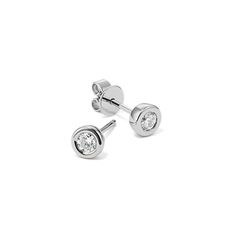 These bezel-set stud earrings are perfect for an everyday touch of sparkle. Crafted in quality sterling silver  they feature a pair of natural diamonds that have been hand-matched for consistent color  clarity  and beauty. Luxury Silver Earrings With Single Diamond, Elegant Silver Diamond Earrings With Tension Setting, Modern Diamond Earrings With Bezel Setting, Silver Diamond Earrings With Tension Setting, Silver Earrings With Tension Setting, White Gold Sterling Silver Bezel Set Diamond Earrings, Timeless Silver Diamond Earrings With Single Diamond, Modern White Gold Earrings With Bezel Setting, Minimalist Bezel Set Diamond Earrings For Formal Occasions