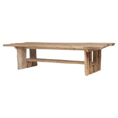 This monumental dining table is a celebration of wabi-sabi style. The modern design is hand-crafted of elmwood timbers reclaimed from Qing-dynasty architecture, each selected for its rich texture and incredible character. Minimally worked, the table highlights the natural beauty of the untouched raw wood carrying centuries of patina. Additional Dimensions: Table Apron to Floor: 29"H Above Shelf: 14"H Below Shelf: 9.5"H Reclaimed Wood Table, Waterfall Design, Wabi Sabi Style, Wood Rustic, Chinese Architecture, Raw Wood, Qing Dynasty, Rich Textures, Wood Table