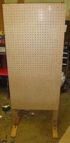 a large white board with holes in it