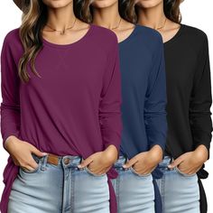 three women's long sleeved shirts with rolled up sleeves and side slits