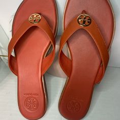 Orange Sandal Tan Leather Open Toe Flip Flops, Designer Leather Flip Flops For Beach, Designer Leather Flip Flops For The Beach, Beach Flip Flops With Leather Lining, Classic Tan Sandals For Summer, Leather Lined Flip Flops For Beach, Casual Tan Sandals With Leather Lining, Adjustable Tan Leather Sandals, Flat Tan Sandals With Leather Footbed