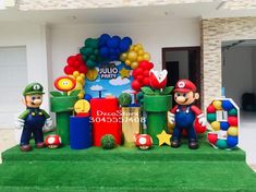 mario birthday decoration with balloons and decorations on the front lawn at a home in florida