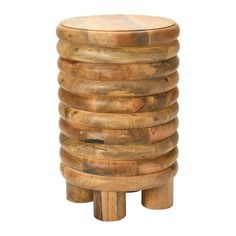 a stack of wooden stools sitting next to each other on top of a white background