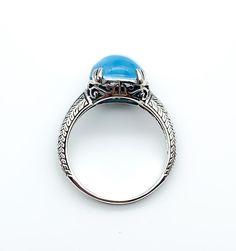 "Art Deco Sterling Silver Pools Of Light Blue Topaz Ring Up for offer is a stunning art deco revival solid sterling silver genuine blue topaz pools of light cabochon ring. Rings are marked \"925\". Measurements Blue Topaz: 10mm x 10mm x 5.5mm/ 5.27cttw Bad Width: 2mm Weight: 3.3 g Materials -Sterling Silver -Blue Topaz Condition: New; Please look closely at the pictures provided as they are an extension of the written description. This item comes from a clean, smoke free household. Item will shi Formal Cabochon Blue Topaz Jewelry, Elegant Blue Topaz Cabochon Ring, Blue Cabochon Ring In Fine Jewelry Style, Blue Cabochon Fine Jewelry Ring, Fine Jewelry Blue Cabochon Ring, Blue Cabochon Rings Art Deco Style, Art Deco Blue Cabochon Rings, Blue Art Deco Rings With Cabochon, Blue Cabochon Art Deco Rings