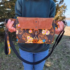 LOVE this hands-free bag when I'm on the go! Can be worn at an angle across the front, or lower and to the side. This Haralson Crossbody bag features beautiful floral fabric designed by Anna Maria Horner, and a natural leather flap. With one exterior zipper pocket and one interior zipper pocket, there's a place for everything. The 1" wide cotton webbing strap is fully adjustable with gunmetal hardware, and made extra long (adjusts up to 50"). Matching keychain included! **CUSTOM fabric color req Floral Print Crossbody Shoulder Bag For Everyday Use, Everyday Floral Print Crossbody Shoulder Bag, Floral Fabric Design, Matching Keychain, Hands Free Bag, Anna Maria Horner, A Place For Everything, Matching Keychains, Gunmetal Hardware