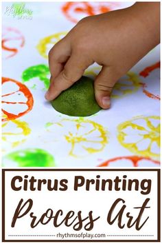 a hand holding a green piece of art with the words citrus printing process on it