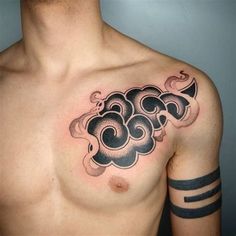 a man with a cloud tattoo on his chest