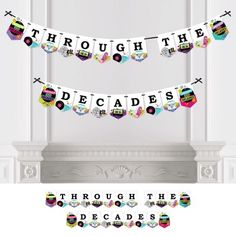 the through the decades banner is hanging in front of a fireplace with other decorations around it