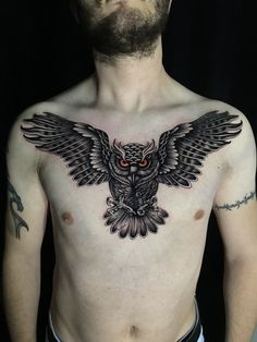 a man with an owl tattoo on his chest