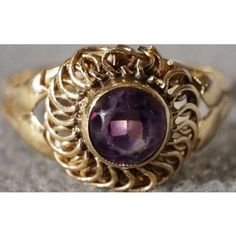 I am offering you this fabulous vintage 14 k yellow gold (stamped) with a round shaped, genuine intense amethyst stone, in a bold ring. This ring features a gorgeous shaped design with spectacular scrolled ridged etching. To enhance this marvelous setting the maker added these fabulous solid thick lines that wrap around this very substantial setting, it also has a very sleek look to it as well. Wow, what fabulous setting this is so very sleek, bold, and solid, check out the perfect color striati Antique 14k Gold Amethyst Ring, Antique Round Amethyst Jewelry, Vintage Purple Round Jewelry, Victorian Amethyst Round Jewelry, Antique Amethyst Jewelry Stamped 14k, Vintage Oval Amethyst Birthstone Ring, Antique Gold 14k Gold Amethyst Ring, Vintage Gold Jewelry With Round Stone, Antique Gold Amethyst Ring In 14k Gold