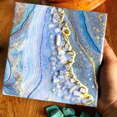 "Geode Mini Art inspired by one of the most serene stones in my collection. I have loved blue lace agate for all its delicate lines and soft beautiful color. This mini Geode painting is a calm shade of blue and has lots of details and textures. A Small Luxury with lots of Sparkle for your space. This painting Is done on a cradled birch board, 6\"x6\" inch with a height of 1.5\" I hope you like it xx lol" Blue Agate Geodes With Natural Stones, Blue Agate Geodes, Handmade Blue Geodes As Gifts, Handmade Blue Geodes As A Gift, Handmade Blue Geodes For Gifts, Handmade Blue Geodes For Gift, Bohemian Agate Geodes As A Gift, Geode Painting, Resin Art Canvas