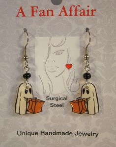 "These adorable light weight earrings feature print art of a ghost trick or treating. Handmade Altered art Made with acrylic, resin and stainless steel connectors and surgical steel ear wire. Highlighted with glass beads. Measure slightly over 1 1/4\" long Pay one low shipping price for all items ordered. US orders ship for $3.50 Visit www.afanaffair.com or the 'Wearable Memories' shop section on Etsy to find out how to put your own photos on jewelry Like us on facebook for money saving coupons Ghost Trick Or Treating, Ghost Trick, Lake Villa, Ghost Costume, Earrings Halloween, Trick Or Treating, A Ghost, Halloween Jewelry, Holiday Jewelry