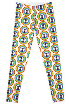 a pair of white leggings with colorful circles and a black dog on it