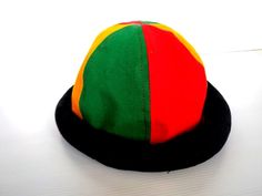 This Rasta Jamaican Bucket hat is perfect for Summer Reggae Festivals. This solid Bucket hat features a Jamaican Rasta Inspired Striped Band atop a solid , Red green yellow Rasta color bucket hat. Rock this hat as you dance the night away at your next outdoor concert or event. Fashionable and a must-have . This Hat is unisex that looks great on both men and women . This Hat is very durable and can be used as a special gift . -Solid Unisex Jamaican Adult Sun Hat -Rasta Reggae Inspired Striped Ban Multicolor Short Brim Bucket Hat, Retro Adjustable Brimmed Bucket Hat, Adjustable Multicolor Bucket Hat, Adjustable Retro Brimmed Bucket Hat, Retro Multicolor Sun Hat With Short Brim, Retro Adjustable Costume Hat, Retro Wide Brim Multicolor Hat, Retro Multicolor Wide Brim Hat, Retro Mini Hat With Short Brim