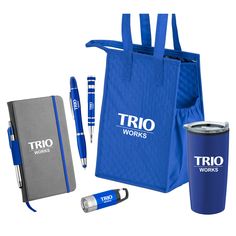 a blue shopping bag, pen and notebook with the words trio works on it