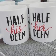 two white coffee mugs with the words half his and her been printed on them