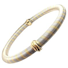 18k Tri-Color (Yellow, White, Pink) Gold And Stainless Steel Trinity Bangle Bracelet by Cartier. Details: Weight: 28 grams Length: 7.5" - Inner Diameter: 61mm Width: At Trinity Motifs: 8.5mm - At Rest Of Bracelet: 6mm Stamped Hallmarks: Cartier OrEtAcier (Serial Omitted) Free Shipping within the United States YOUR PRICE: $4,500 2751othd Cartier Bracelet, Gold Bangle Bracelet, Gold Bangle, Gold Bangles, Tri Color, Pink Gold, Yellow Color, Bangle Bracelet, Cartier