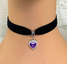 Black 16 mm Nylon Velvet Choker Necklace Purple Faceted Heart Shape Acrylic Jewel with clear rhinestones Pendant measures approx 20 x 20 mm Choker measures approx 33 cm (13 inches) with a 5 cm ( 2 inch) silver plated extender chain, clamps and lobster clasp. Can also make to any length if required just leave a message when paying as to the size you need Any questions please ask Thank you for looking Heart Charm Choker For Party, Adjustable Heart Pendant Choker For Parties, Round Heart Charm Jewelry For Party, Gothic Heart Pendant Necklace For Party, Adjustable Purple Rhinestone Jewelry, Adjustable Crystal Choker As A Gift, Gothic Heart Charm Jewelry For Parties, Gothic Party Jewelry With Heart Charm, Adjustable Rhinestone Choker As Gift