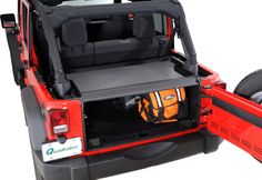 the back end of a jeep with its cargo compartment open and wheels down, on a white background