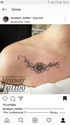 a woman's chest with a flower tattoo on it