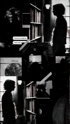 black and white photograph of people standing in front of bookshelves with one person looking at them