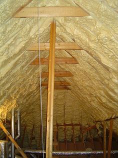 the inside of an attic with exposed walls and insulation in place to protect it from rain