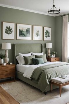 a bedroom with green walls and pictures on the wall