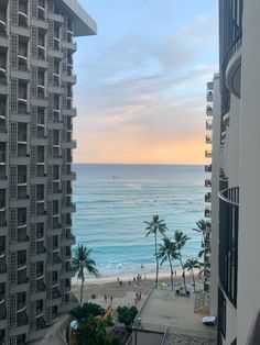 a view of the beach from an apartment building