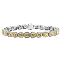 This gorgeous bracelet features 27 cushion cut fancy yellow diamonds weighing 12.92 carats total. Each stone is surrounded by a single row of brilliant round diamonds weighing 2.04 carats total. Made with 18 karats of yellow and white gold. Roman Malakov is a custom house, specializing in creating anything you can imagine. If you would like to receive a special quote on a custom piece please message or call us. Halo Bracelet, Fancy Yellow Diamond, Modern Bracelets, Cushion Cut Diamonds, Gorgeous Bracelet, Cushion Cut, Brilliant Diamond, Yellow Diamond, Yellow Color