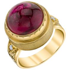 This gorgeous ring features a fine 10.75 carat rubellite tourmaline cabochon of extraordinary color and quality. A stunning gem with vibrant, rich color and excellent clarity, it is beautifully bezel set in an exquisite ring that showcases a superior level of craftsmanship seldom seen today. Two brilliant cut diamonds accent the hand-engraved band. This style is extremely comfortable to wear and perfect both for every day and special occasions! Handmade in 18k yellow gold by our Master Jewelers Rubellite Ring, Hand Engraved Rings, Diamond Signet Ring, Vintage Cocktail Ring, Rubellite Tourmaline, Gold Engraving, 18k Yellow Gold Ring, Tourmaline Ring, Gold Diamond Rings