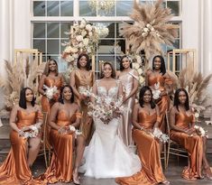 the bride and her bridal party pose for a photo