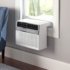 an air conditioner sitting in front of a window