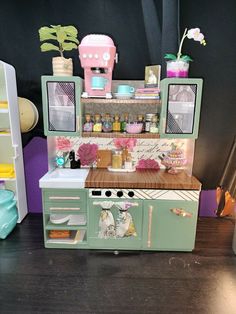 an old fashioned toy stove and oven in a play kitchen