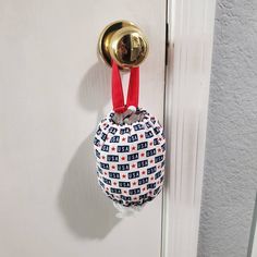 a door handle with a small bag hanging from it