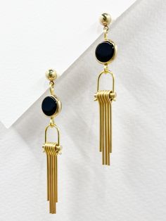 Minimalist Metal Dangle Chandelier Earrings, Modern Onyx Drop Earrings, Modern Brass Dangle Jewelry, Modern Gold Onyx Earrings, Modern Chandelier Dangle Earrings, Modern Black Long Drop Jewelry, Modern Brass Dangle Linear Earrings, Modern Brass Chandelier Earrings, Modern Brass Linear Earrings For Formal Occasions