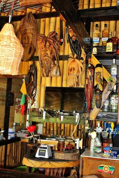 an assortment of african masks on display in a store