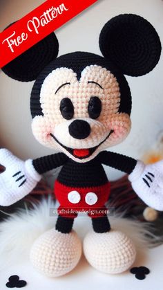 a crocheted mickey mouse is posed for a photo