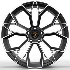 a wheel that is black and white with a ferrari emblem on the front tire rim