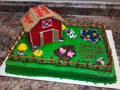 a cake that is shaped like a farm scene