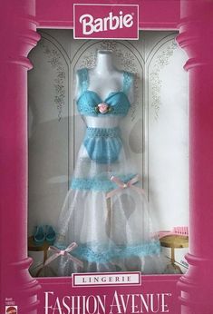 the barbie doll is wearing a blue and white dress