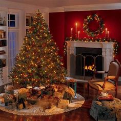 a living room with a christmas tree and fireplace